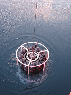 A CTD (conductivity, temperature, and depth) instrument comes up from the depths of the Chukchi Sea. Aboard the USCGC Healy.