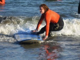 Amy Kirkham surfing 