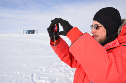 January 15: Taking a photograph during an IceTop outing.  Credit: Hans Niederhausen.