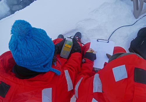 Mariko Hatta and Johna Winters recording water column data