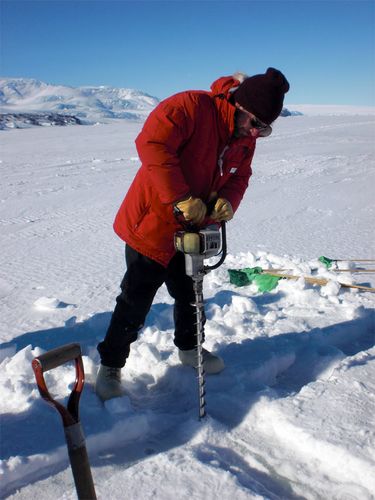 Scott drills for ice.