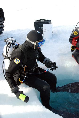 Francois enters the dive hole.