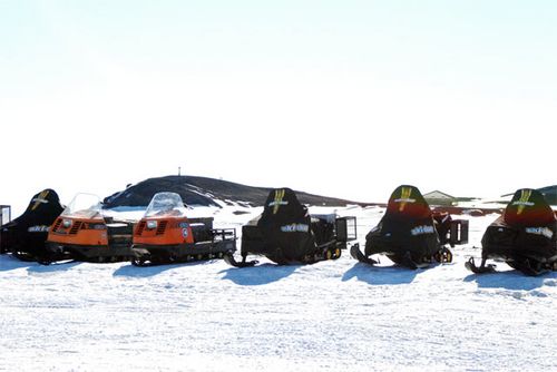 A row of snowmobiles.