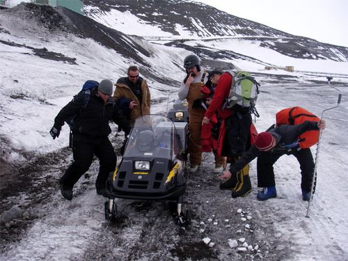 The guys who mange all of the  snowmobiles.