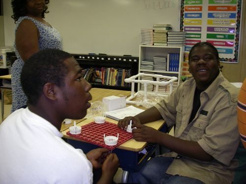 Vernon and Rashad attach pumps to the base.