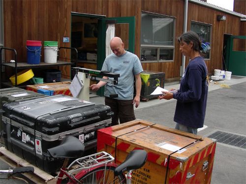 Bob and Stacy weighing one of the  crates. The total shipment was 1367  pounds.