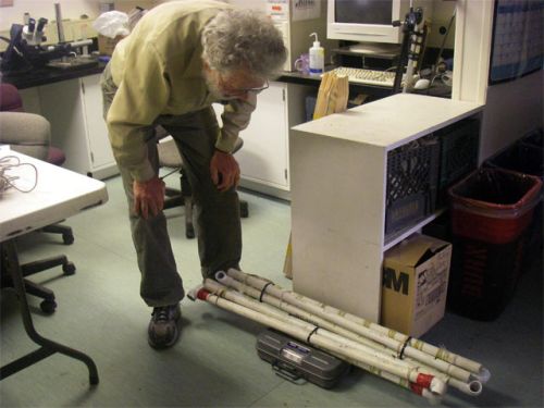 Peter Ray is weighing the PVC tubes.