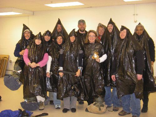 PolarTREC teachers model their improvised weather protection.