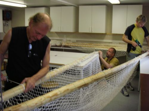 Dr. Tero Härkönen and the seal team work on an extra large net for leopard seals