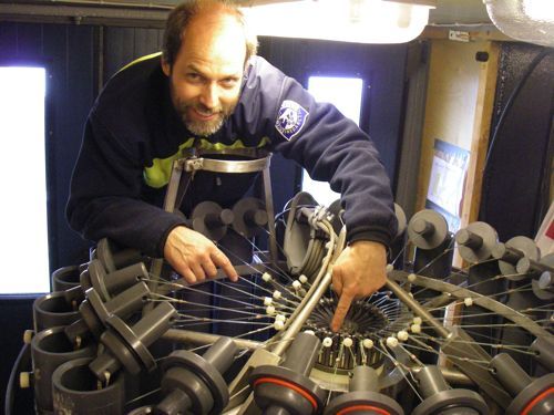 Christian points to the magnetic triggers that allow the spring loaded stoppers to close on the water sample bottles