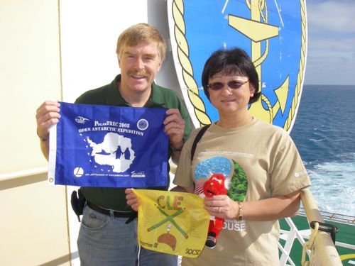 Dr. Xiaojun Yuan exchanges flags with me outside the bridge