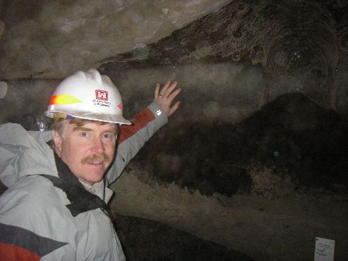 Mr. Peneston touches a small pond that was frozen over 40,000 years ago!