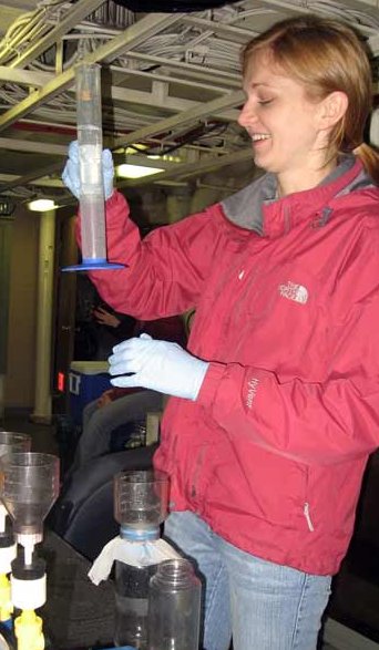 Kristen Blattner measuring water for chlorophyll extraction.