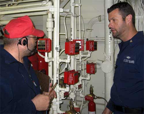 DCC Marsden conferring with Chief Boatswain's Mate Kidd