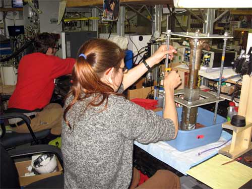 Heather compressing a sediment sample.