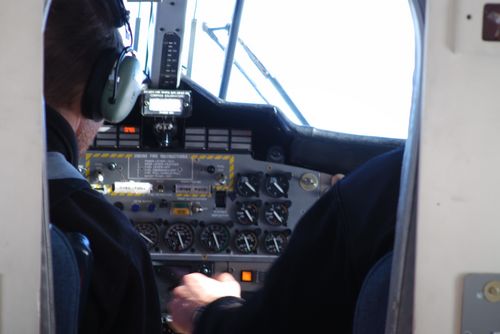 Jim and Louie in the cockpit of the Twin Otter