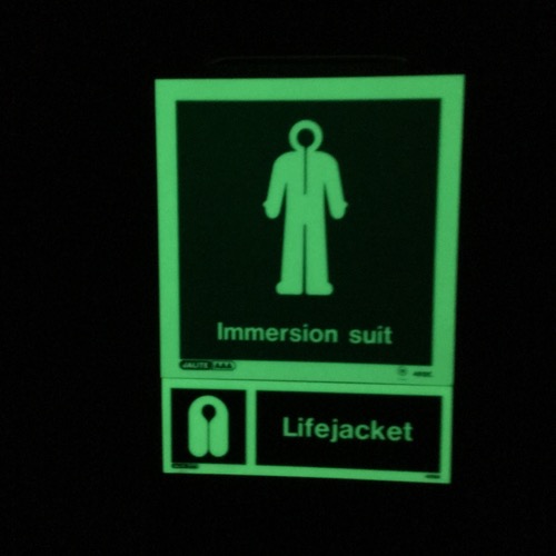 Glow in the dark Immersion suit sticker on our hanging locker.  September 1, 2017.  Photo by Lisa Seff.