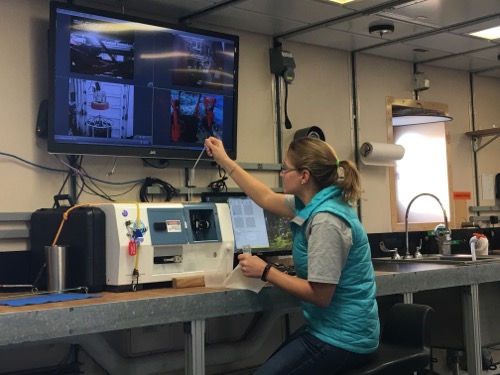 Dr. Kate Lowry calibrates and sets up the FlowCAM with an underway sea water sample.