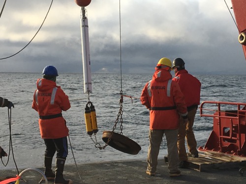 Acoustic Zooplankton Fish Profiler goes in the water off the aft deck of the R/V Sikuliaq.  The AZFP was set on mooring on the bottom of the Beaufort Sea floor.  August 2017.  Photo by Lisa Seff.  