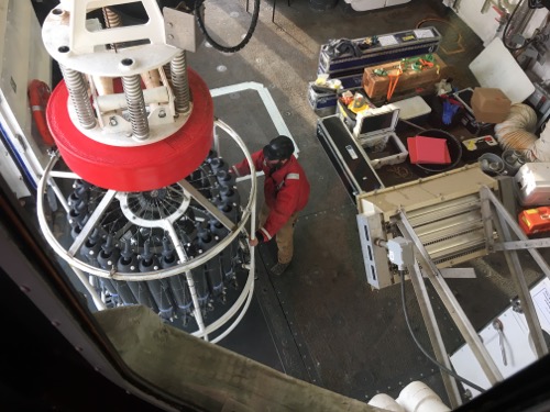 View of the CTD Rosette with Niskin bottles from the winch room.  