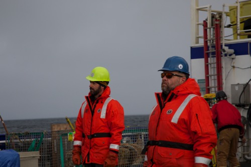 Dr. Joel Llopiz and Dr. Mike Lowe monitor the mid-water trawl net during it&#39;s tow in the Beaufort Sea.  August 2017.  Photo by Lisa Seff.