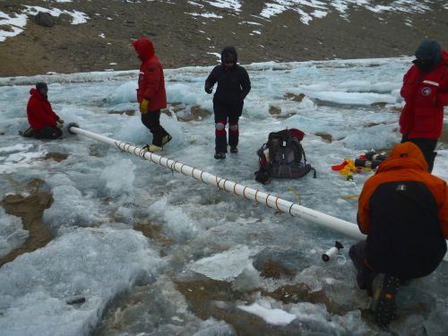 G-063 readying the insert that will keep the hole relatively ice free for the next year.