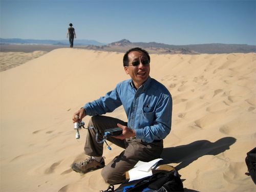 Dr. Henry Sun testing sand on the Kelso Dunes