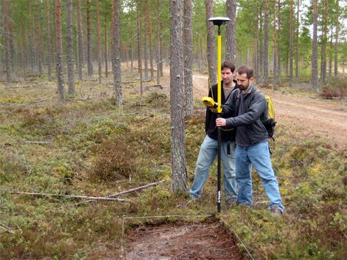 greg and Dustin use the GPS rover pole 