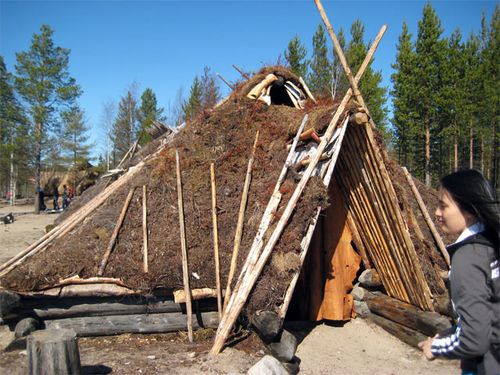 Loretta Sun at the reconstructed pit houses