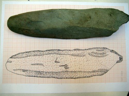 Stone axe with drawing 