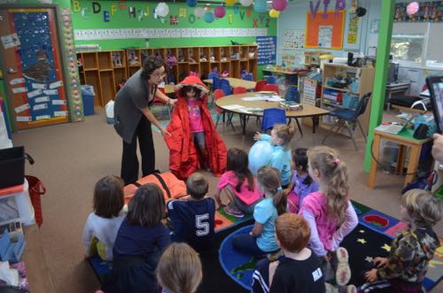 Student tries on Big Red coat.