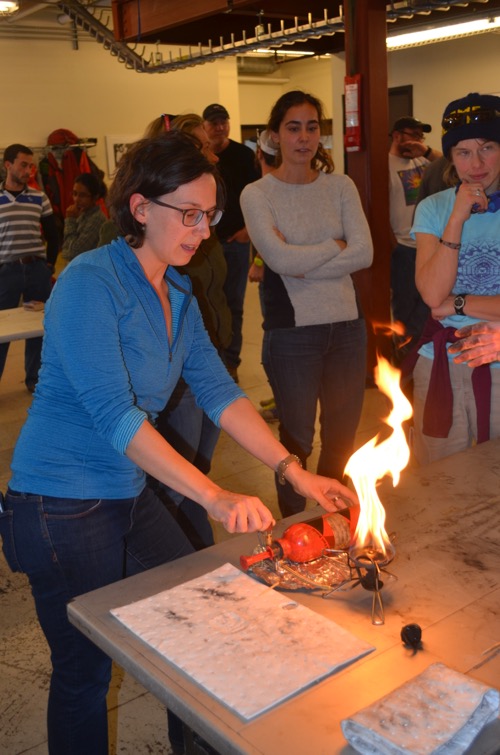 Michelle Brown lights a stove