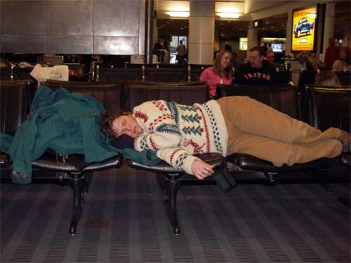 Cathy takes a nap in the Seattle Airport.