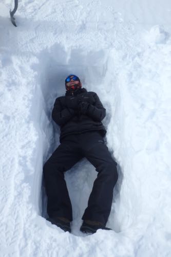 Laying in a Snow Pit