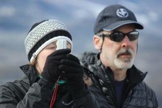 Nat assisting Alia on how to use an inclinometer