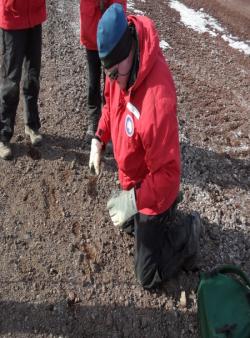 Andrew Klein collects a sediment sample at Arrival Heights, Antarctica. Arrival Heights, Antarctica.