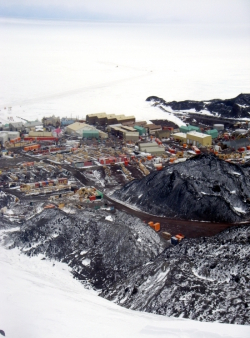 A view of McMurdo Station from above at the former grounds of the nuclear power plant. Looking out over the harbor and McMurdo Sound, Antarctica.