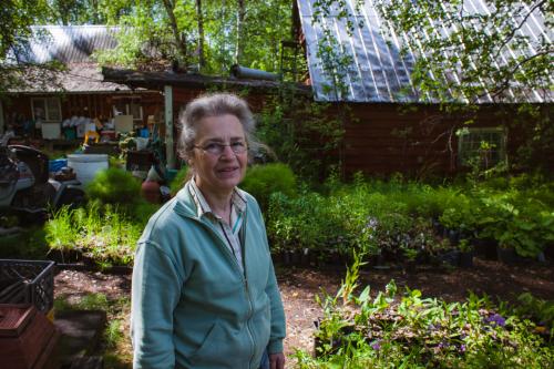 Woman in front of sunken house