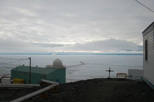 The midnight sun shining behind the clouds.  Local time 1:09 am.