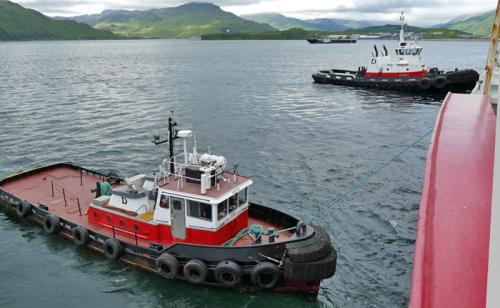 Tugboats Pulling Healy Away from Dock