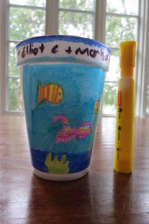 Styrofoam Cup next to a yellow highlighter for scale.  