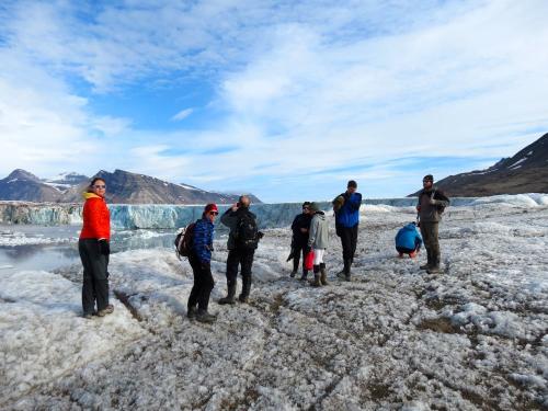 REU students hiking above a glacier.  What do you call the part of Earth covered by ice?