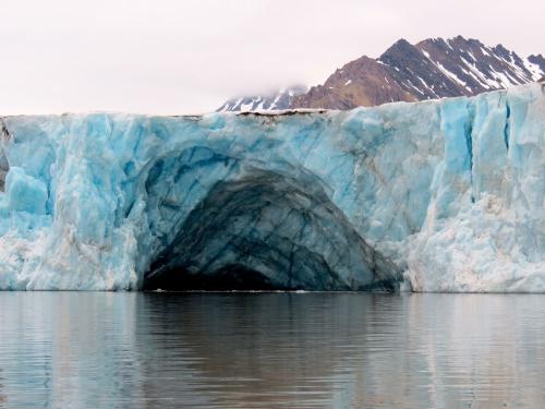 Why does water from under the glacier float to the top?