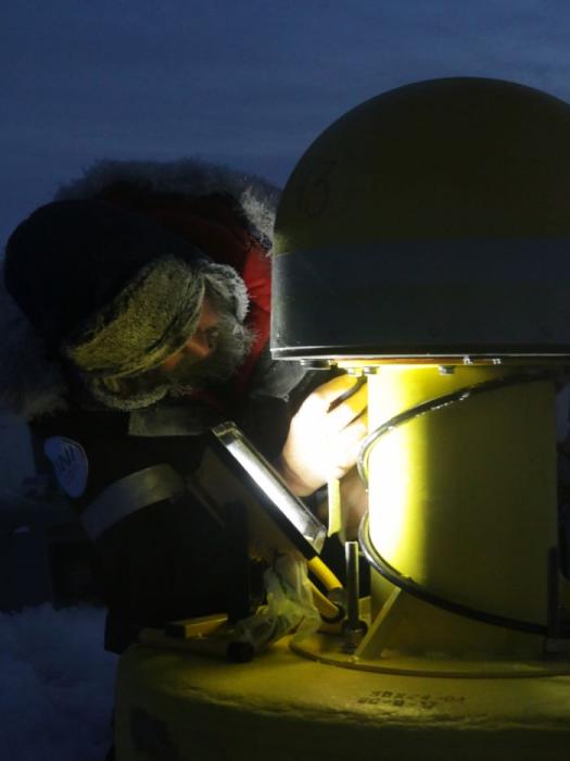 Man deploying research buoy