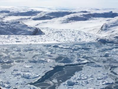 Land and sea ice in Greenland. The landscape of Greenland is barren and ice covered which most people have never seen before.