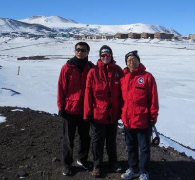 Bault poses with her research team of Dr. Hongjie Xie &amp; Dr. Yongli Gao