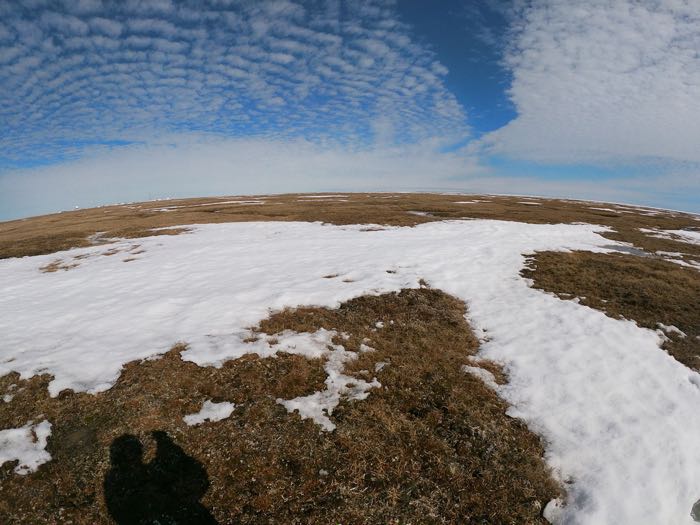 Looking out at the partially snow-covered Tundra in Barrow, Alaska