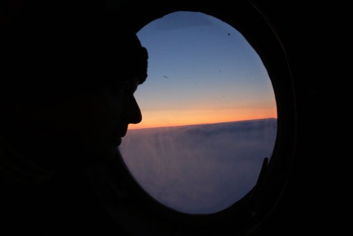 Person looking out helicopter window