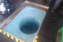 A dive hole inside the dive hut just off of the shores of McMurdo Station, Antarctica.