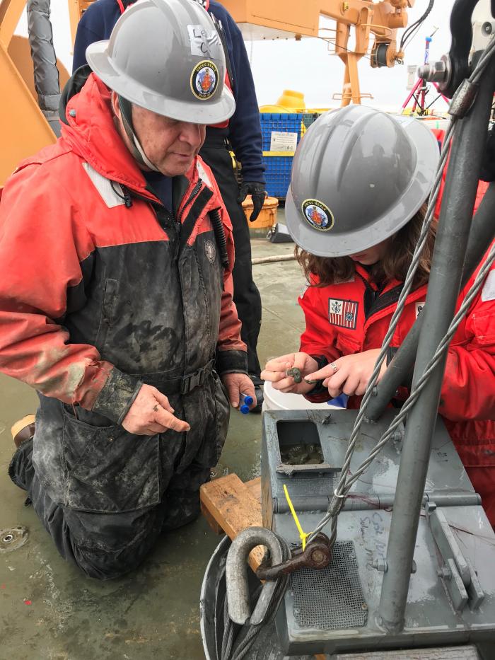 Dr. Lee Cooper and Kelly Kapsar getting top mud from a Van Veen grab for the harmful algal bloom study on Alexandrium.